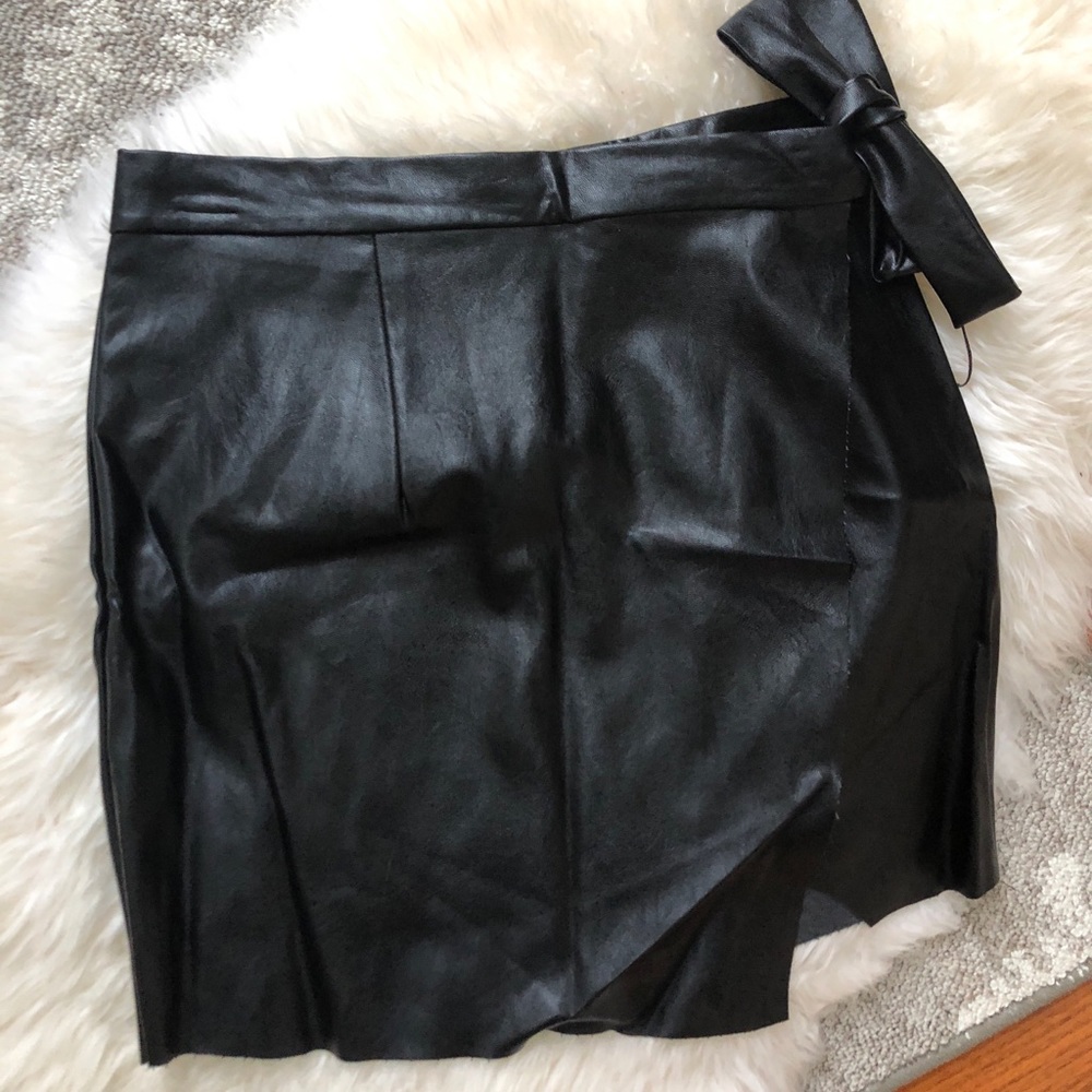 Black faux leather mini skirt. NEW with tags